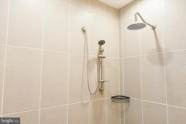 a spacious bathroom with a tub and shower