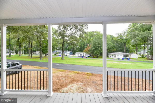 a view of a room with porch and floor to ceiling windows