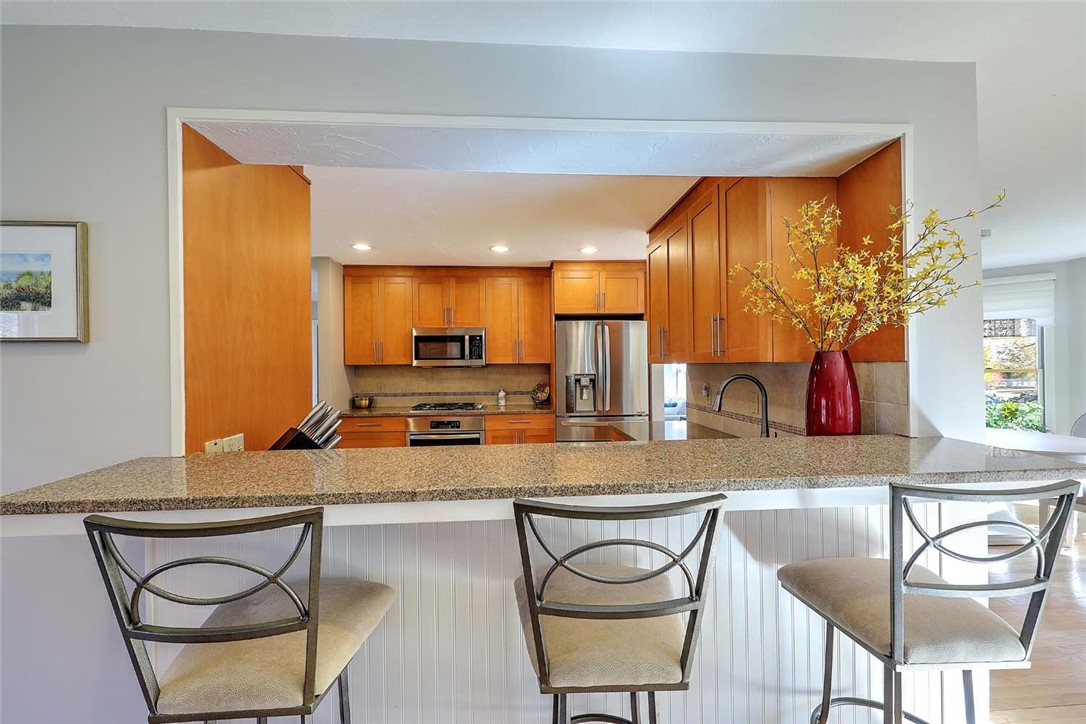 1 Anvil Drive Cumberland, RI 02864 - Photo 15 of 50 Counter bar seating with wainscoting below