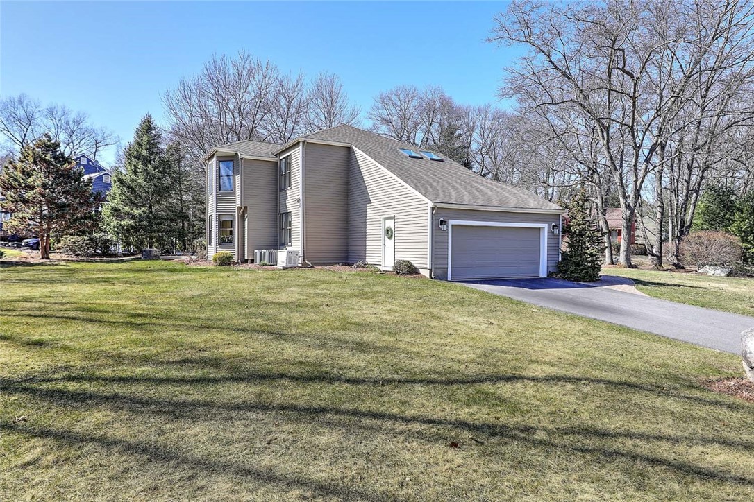 1 Anvil Drive Cumberland, RI 02864 - Photo 47 of 50 Side yard with driveway and 2 car garage