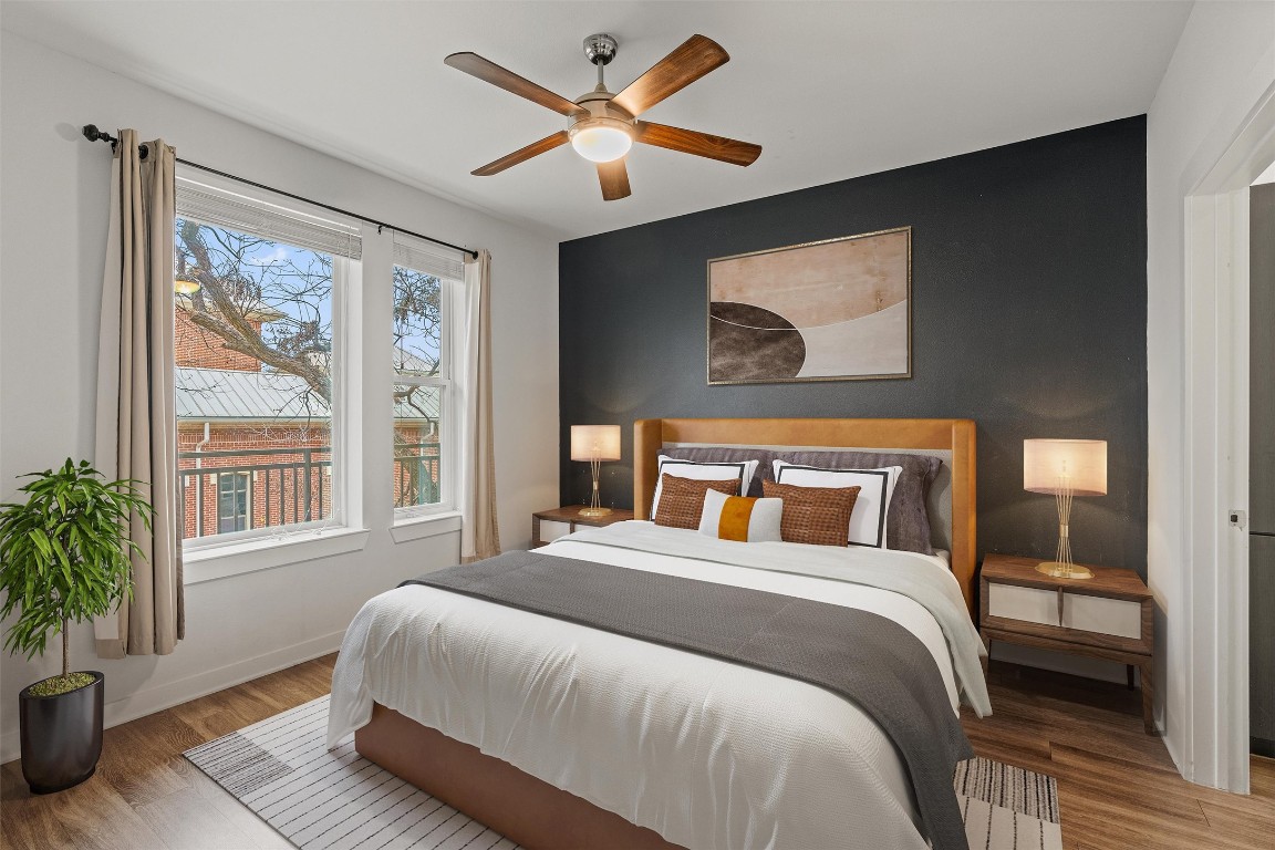 1900 Barton Springs Road, Unit 4037 Austin, TX 78704 - Photo 11 of 34 a bedroom with a large bed and a large window