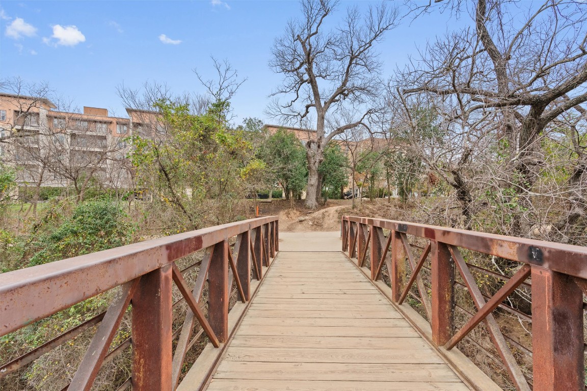 1900 Barton Springs Road, Unit 4037 Austin, TX 78704 - Photo 29 of 34 a view of a balcony with wooden stairs and fence