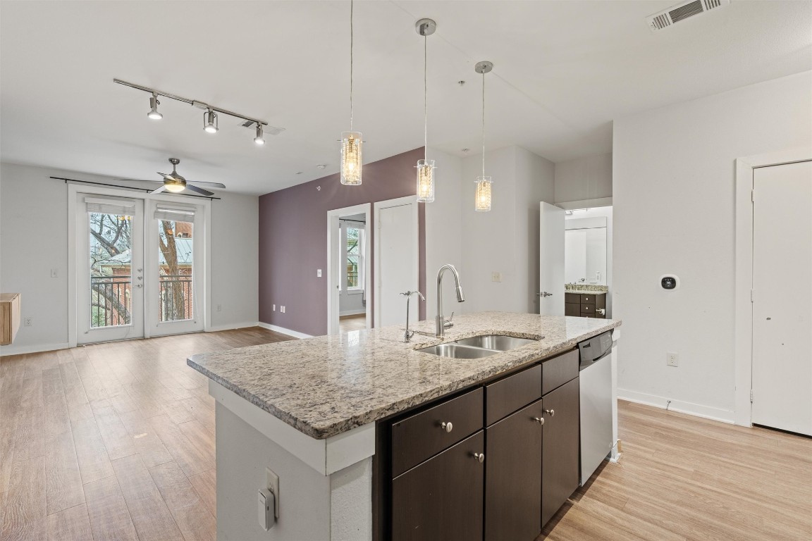 1900 Barton Springs Road, Unit 4037 Austin, TX 78704 - Photo 6 of 34 a bathroom with a granite countertop sink and a mirror
