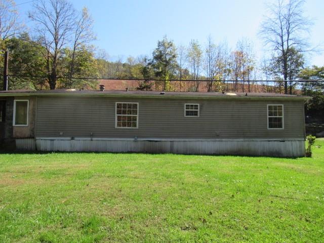 121 Hoy Run Road Spraggs, PA 15362 - Photo 2 of 25 a view of a backyard with a garden and trees