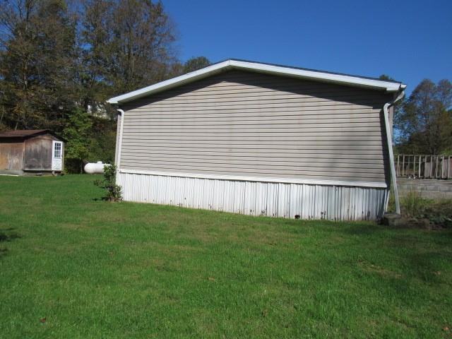 121 Hoy Run Road Spraggs, PA 15362 - Photo 4 of 25 a front view of a house with a yard