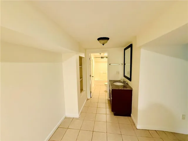 a bathroom with a sink and shower