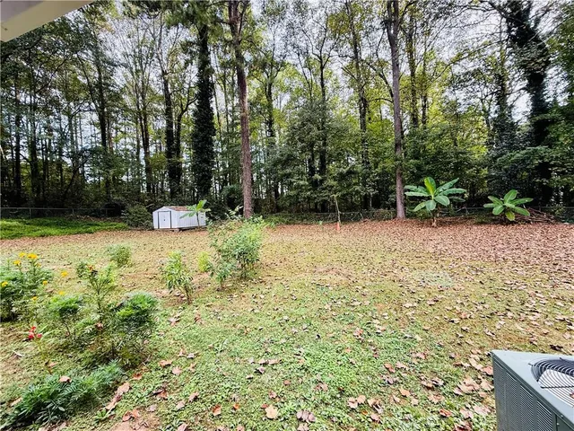 a backyard of a house with lots of green space