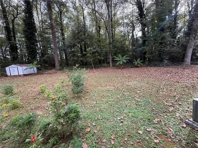 a view of backyard with green space