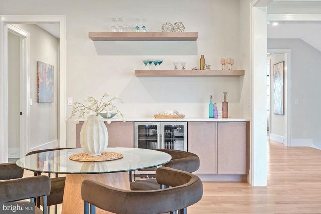 a kitchen with a sink stove cabinets and refrigerator