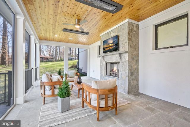 a spacious bedroom with a bed and a large window