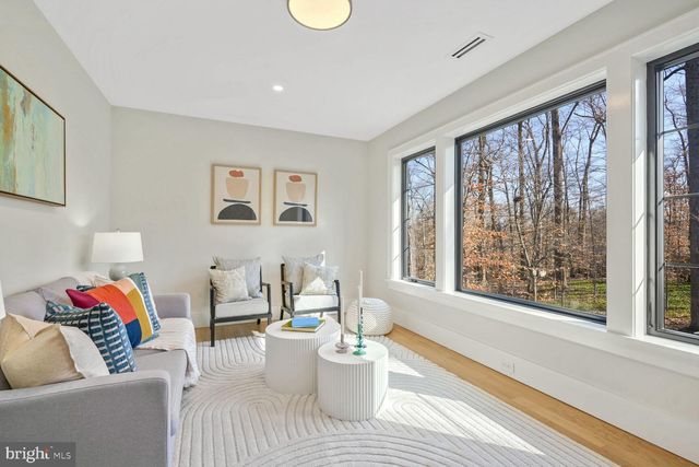 a bed room with a bed furniture and painting on the wall