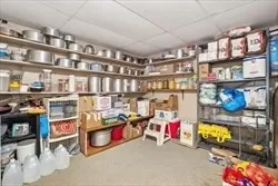 a room with water heater and shelf