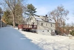 a view of a house with a snow in front of house
