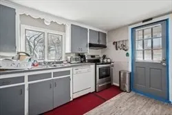 a kitchen with a sink cabinets and window