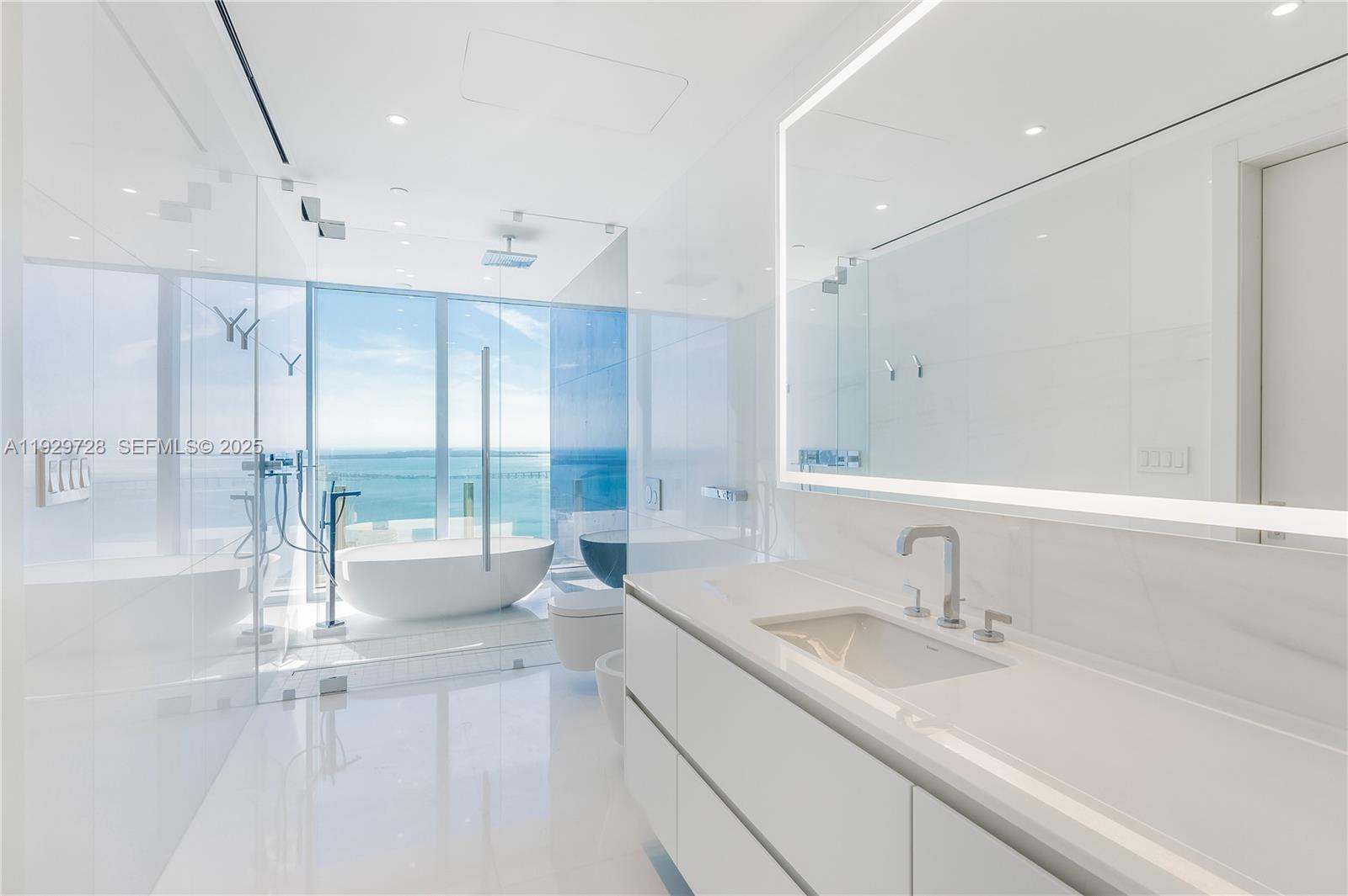 300 Biscayne Blvd Way, Unit 4401 Miami, FL 33131 - Photo 12 of 21 a bathroom with a sink and a large mirror