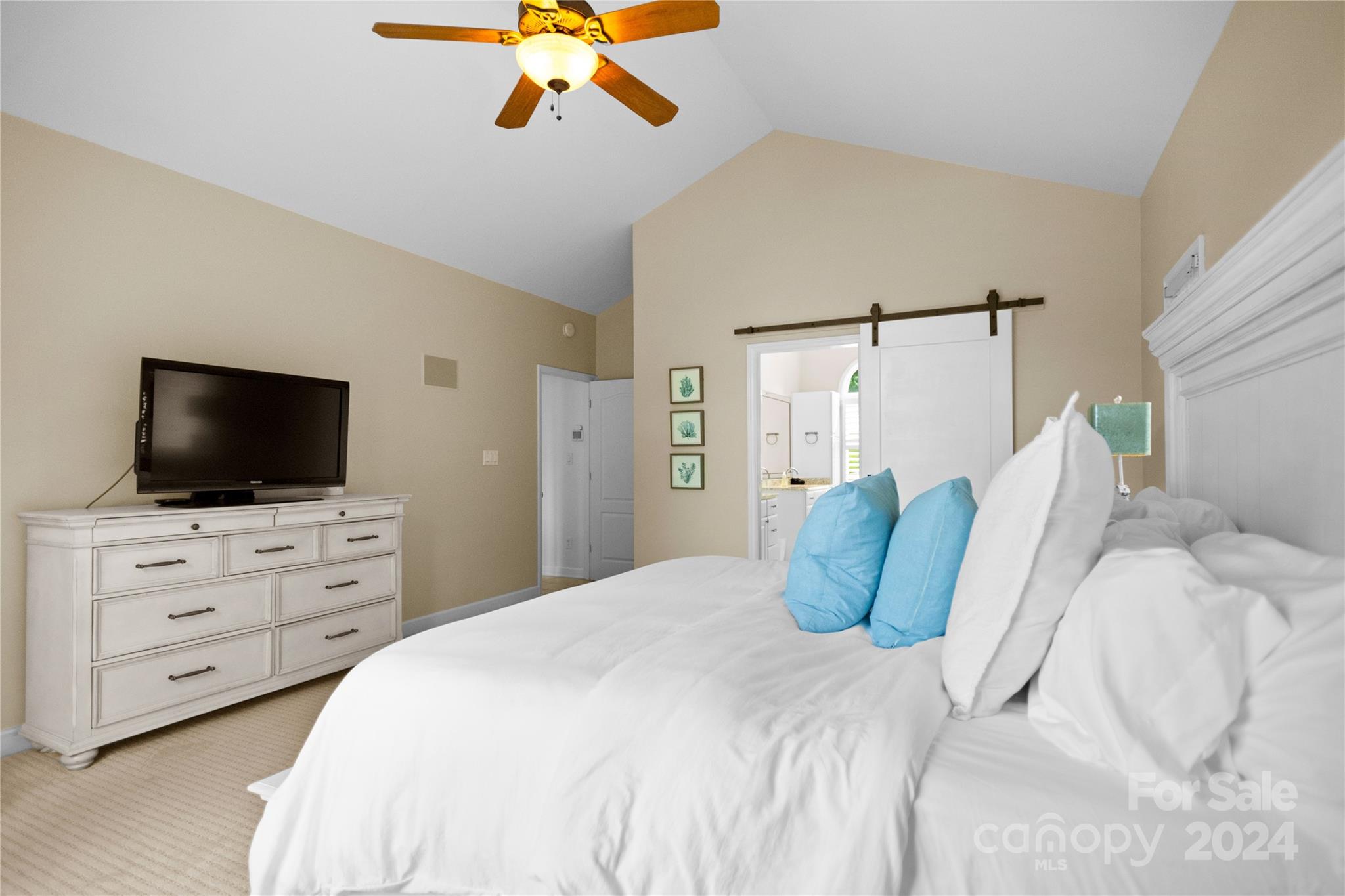 5008 Webbs Chapel Church Road Denver, NC 28037 - Photo 20 of 48 a bedroom with a bed a dresser and flat screen tv