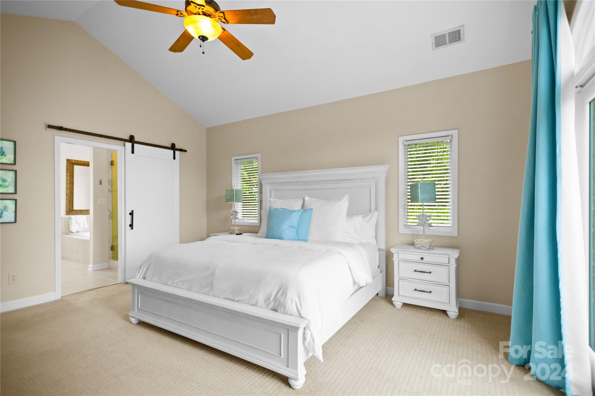 5008 Webbs Chapel Church Road Denver, NC 28037 - Photo 21 of 48 a bedroom with a bed and a chandelier