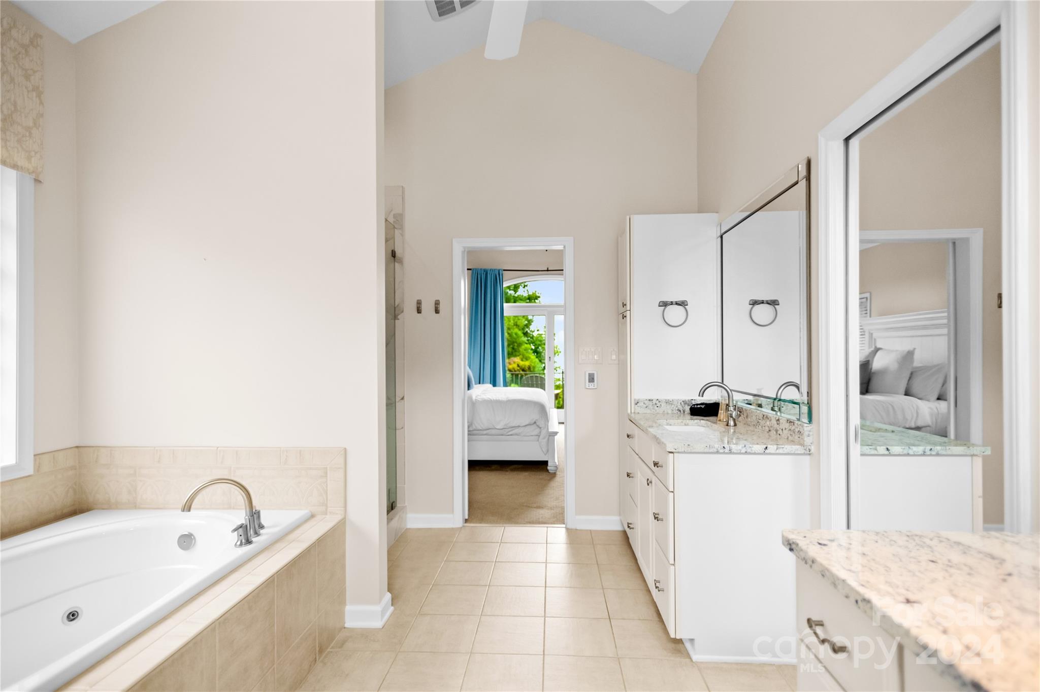 5008 Webbs Chapel Church Road Denver, NC 28037 - Photo 23 of 48 a spacious bathroom with a tub sink and mirror