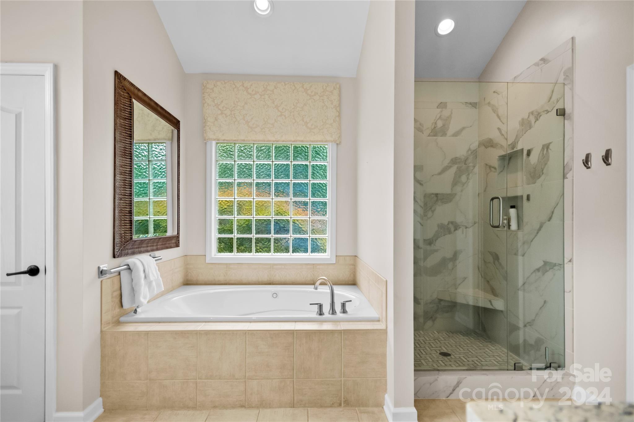 5008 Webbs Chapel Church Road Denver, NC 28037 - Photo 24 of 48 a bathroom with a bathtub and shower