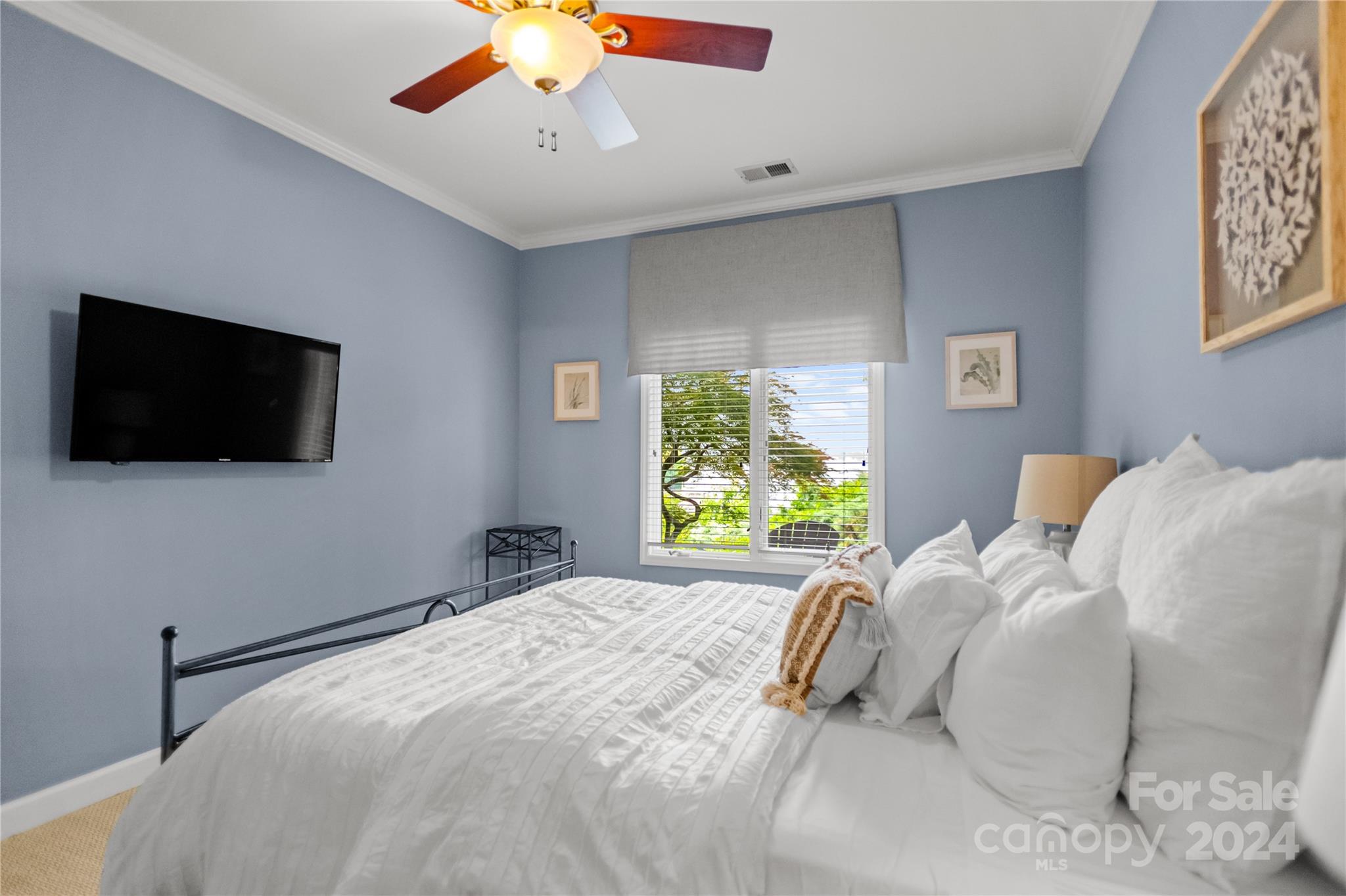 5008 Webbs Chapel Church Road Denver, NC 28037 - Photo 25 of 48 a bedroom with a bed and a flat screen tv
