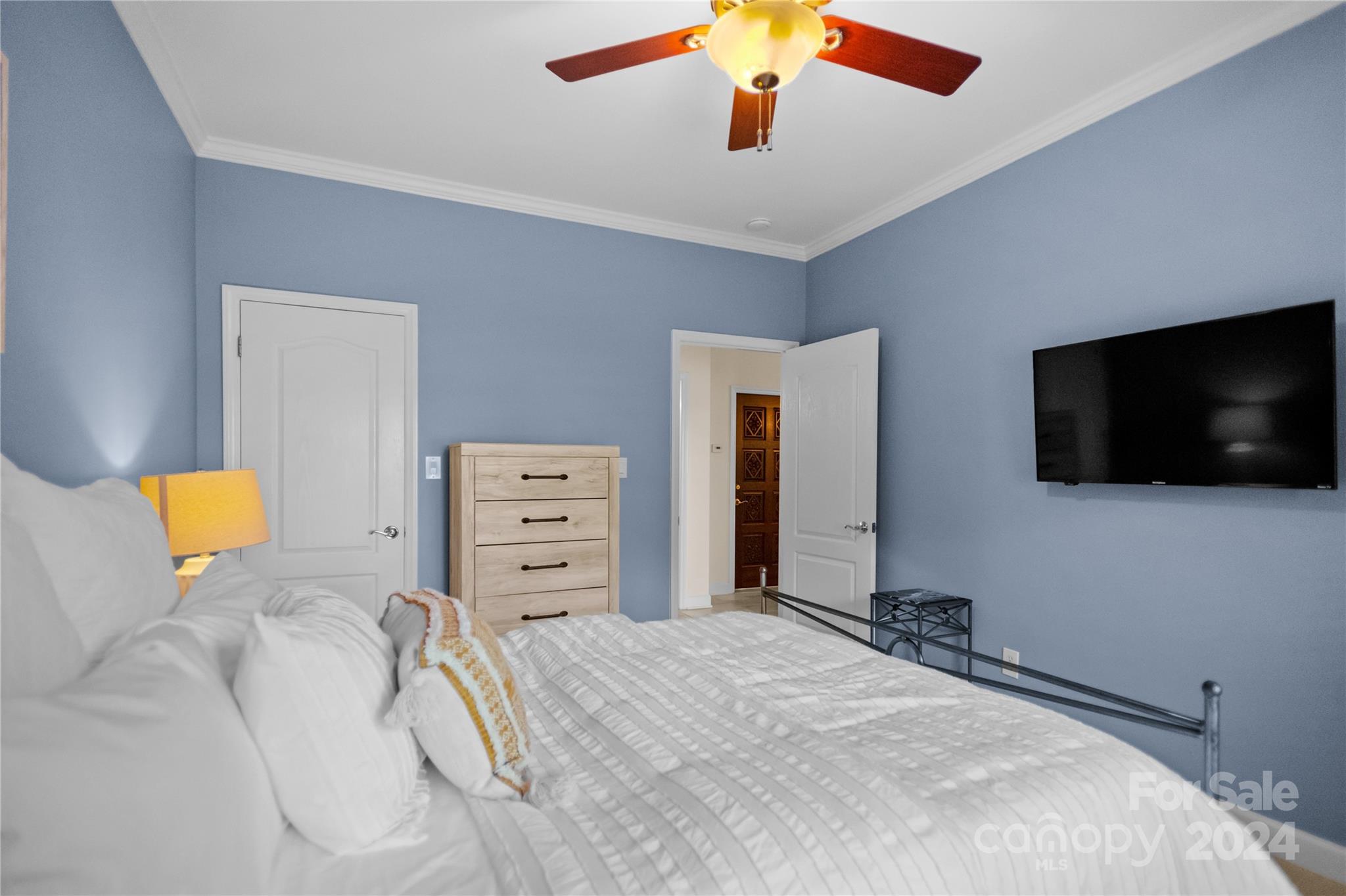 5008 Webbs Chapel Church Road Denver, NC 28037 - Photo 26 of 48 a bedroom with a bed and a flat screen tv