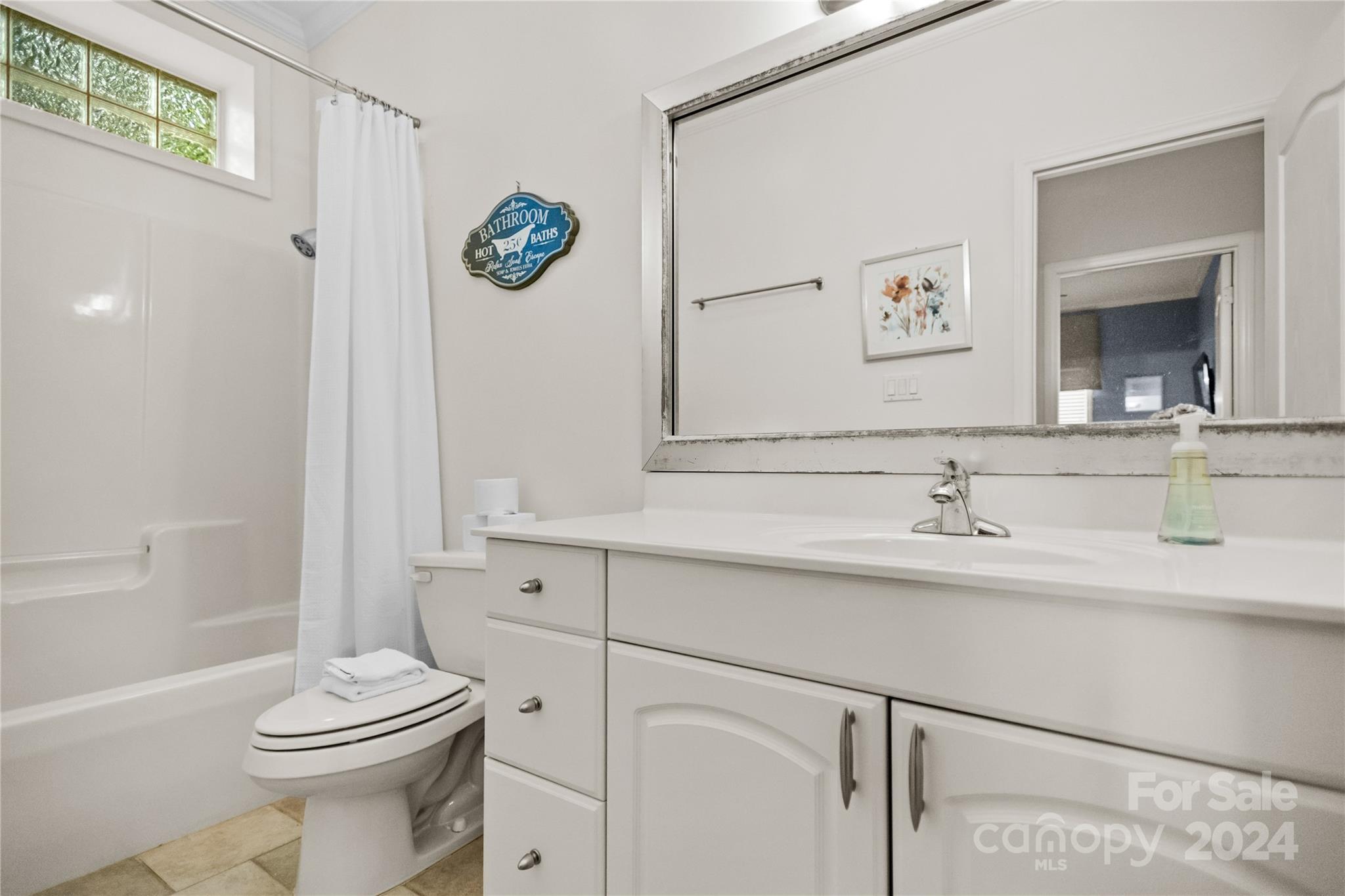 5008 Webbs Chapel Church Road Denver, NC 28037 - Photo 27 of 48 a bathroom with a sink a toilet and a mirror