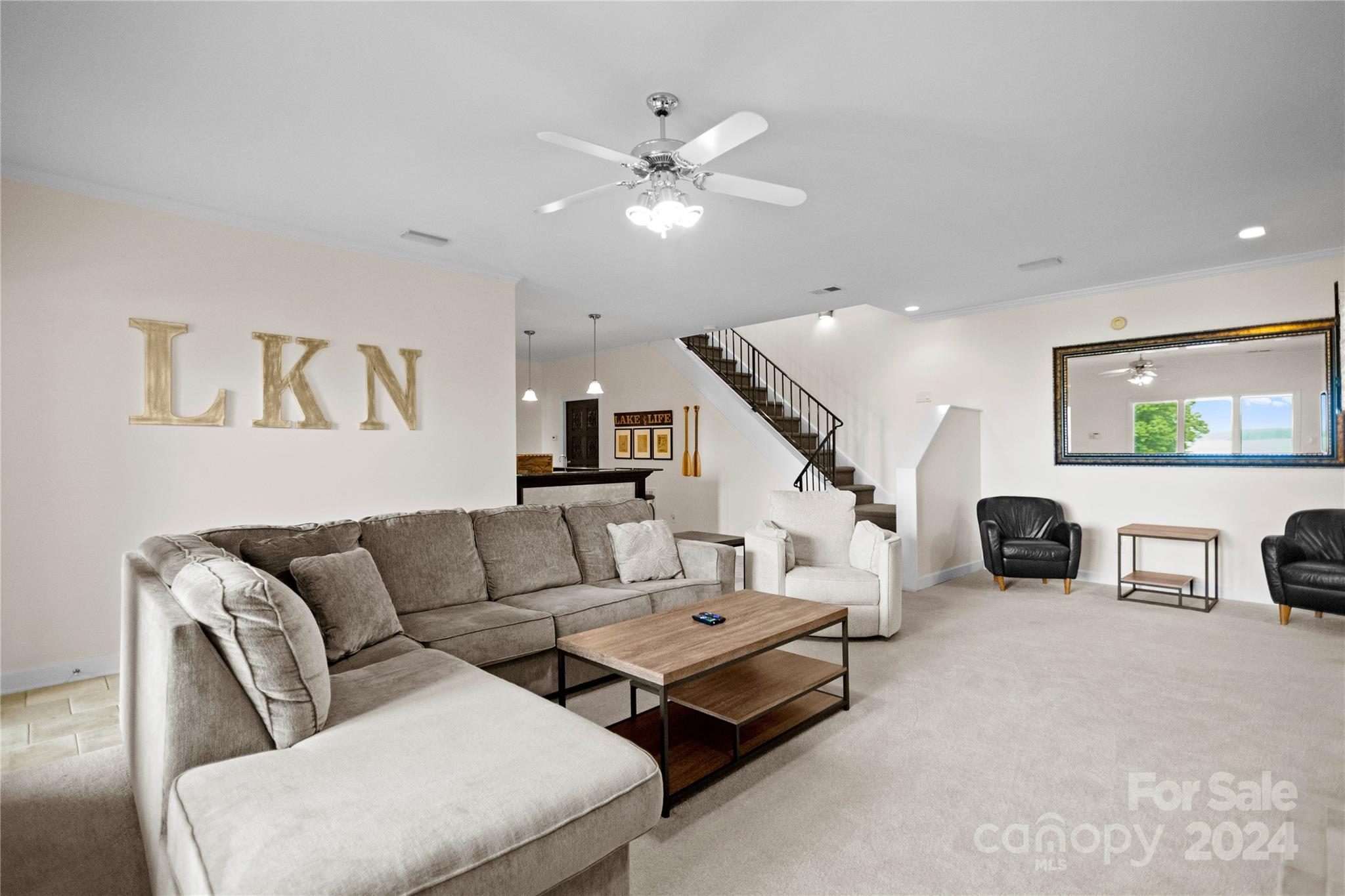 5008 Webbs Chapel Church Road Denver, NC 28037 - Photo 36 of 48 a living room with furniture and a ceiling fan