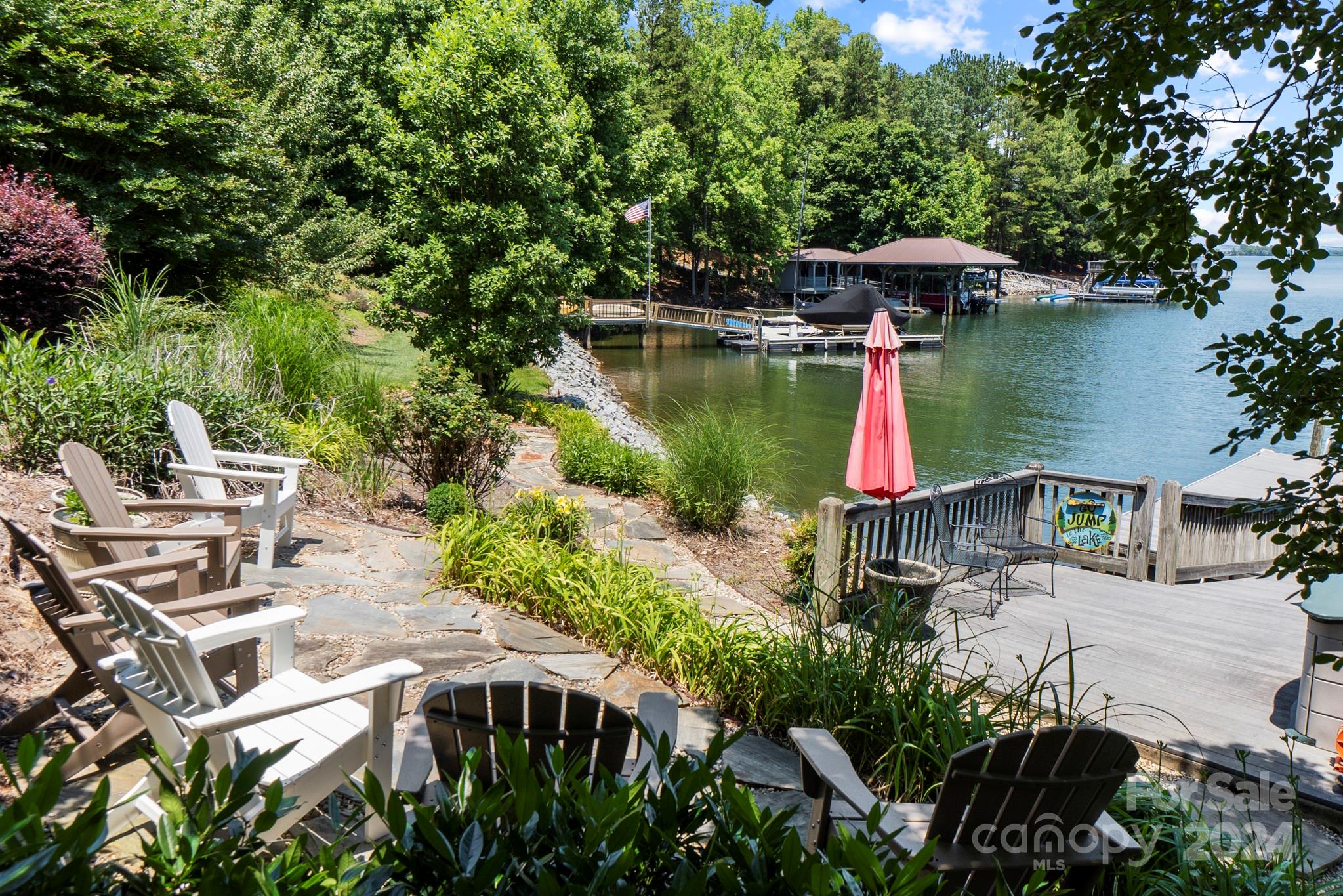 5008 Webbs Chapel Church Road Denver, NC 28037 - Photo 45 of 48 an outdoor space with furniture and umbrella