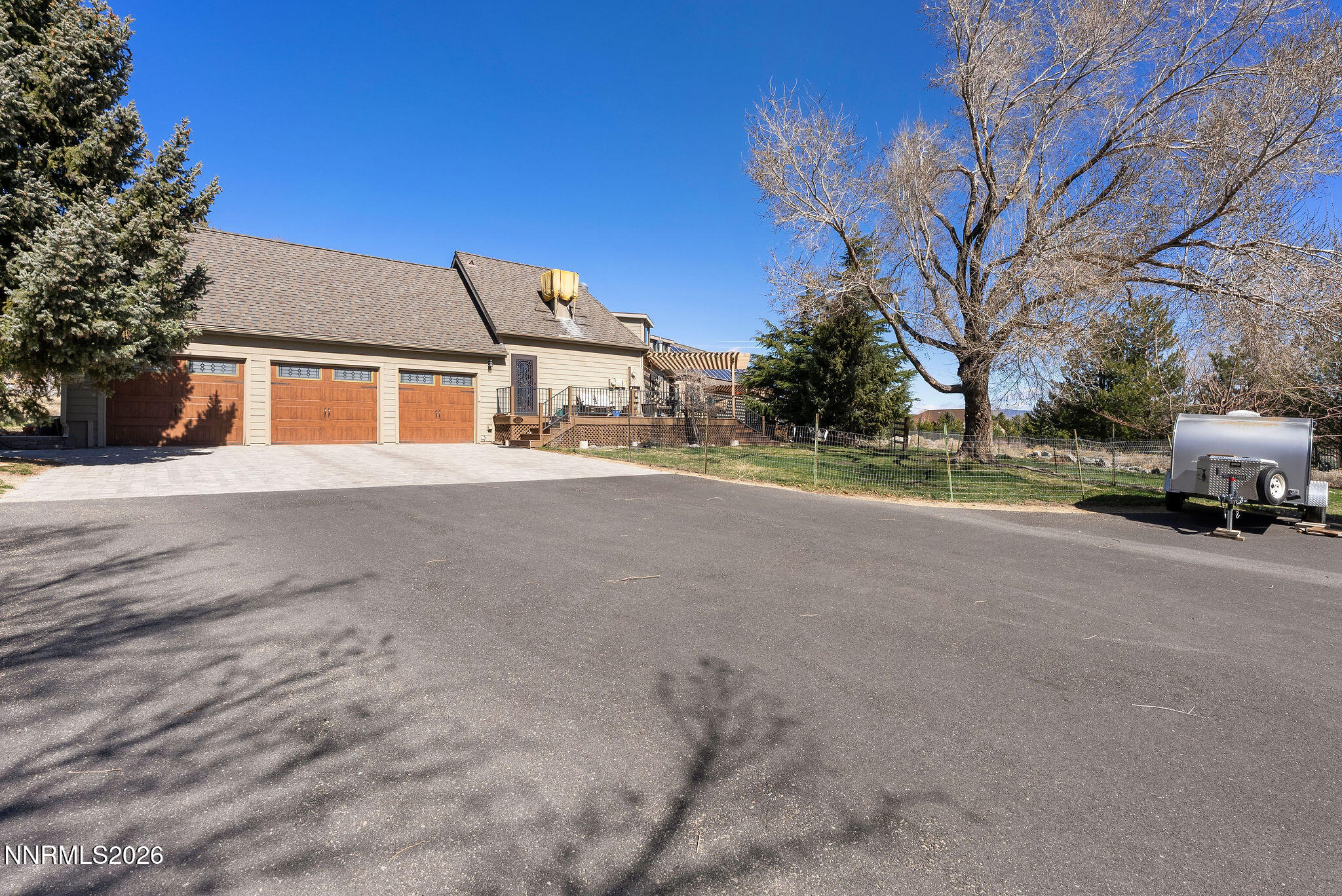 220 Limousin Court Genoa, NV 89411 - Photo 4 of 77 a view of a house with a street