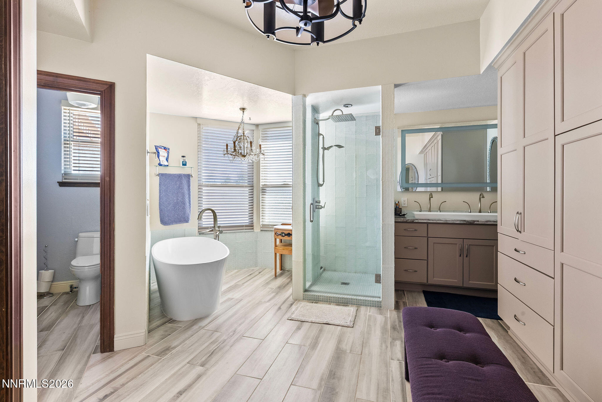 220 Limousin Court Genoa, NV 89411 - Photo 48 of 77 a spacious bathroom with a double vanity sink a mirror a toilet and a shower