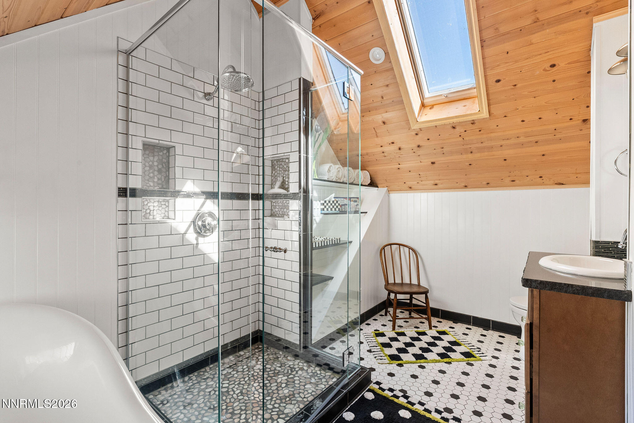 220 Limousin Court Genoa, NV 89411 - Photo 59 of 77 a bathroom with a sink a mirror and shower