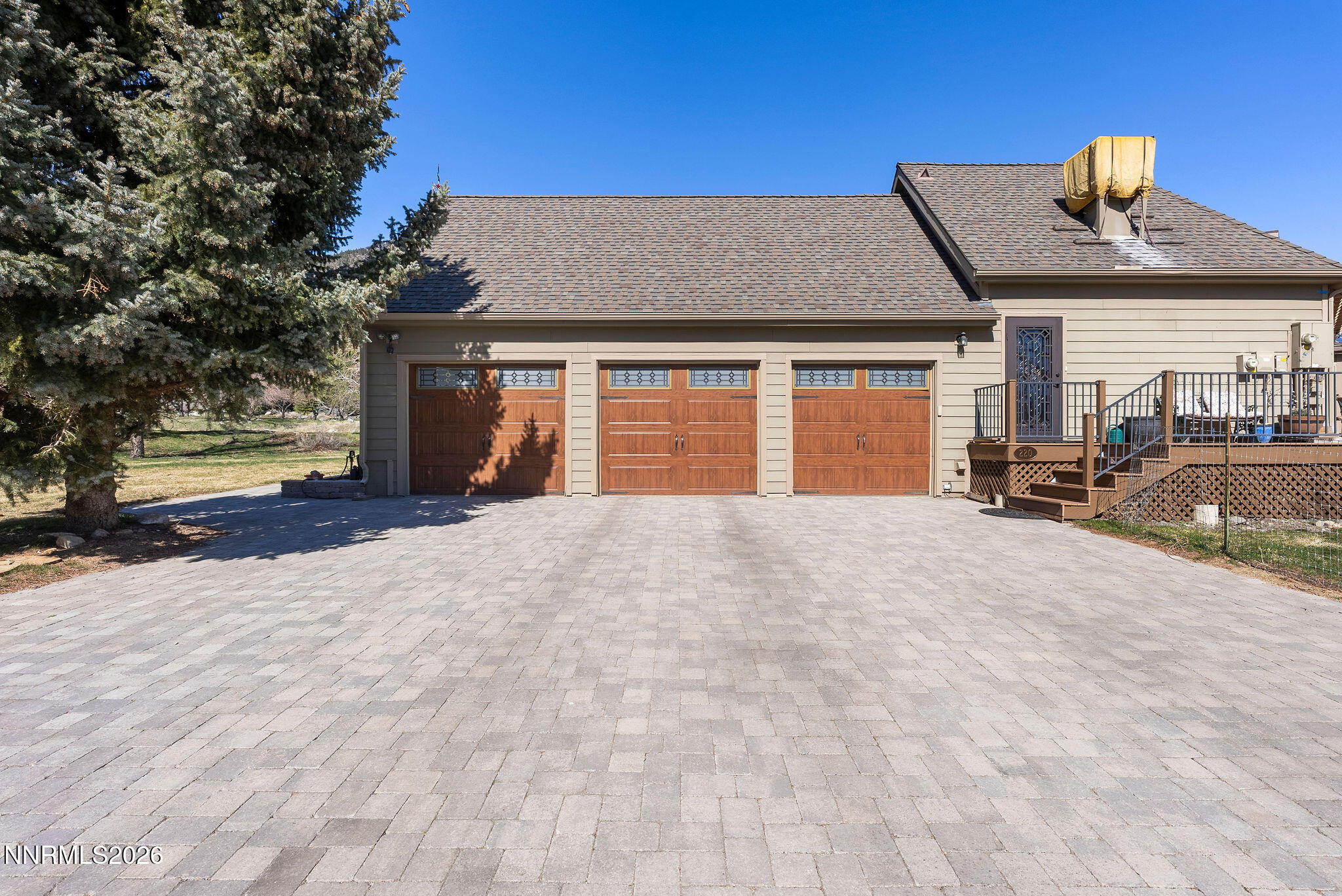 220 Limousin Court Genoa, NV 89411 - Photo 6 of 77 a front view of a house with a yard and garage