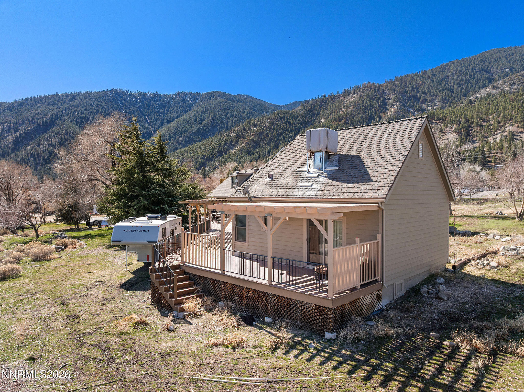 220 Limousin Court Genoa, NV 89411 - Photo 69 of 77 a view of a house with a yard covered with snow
