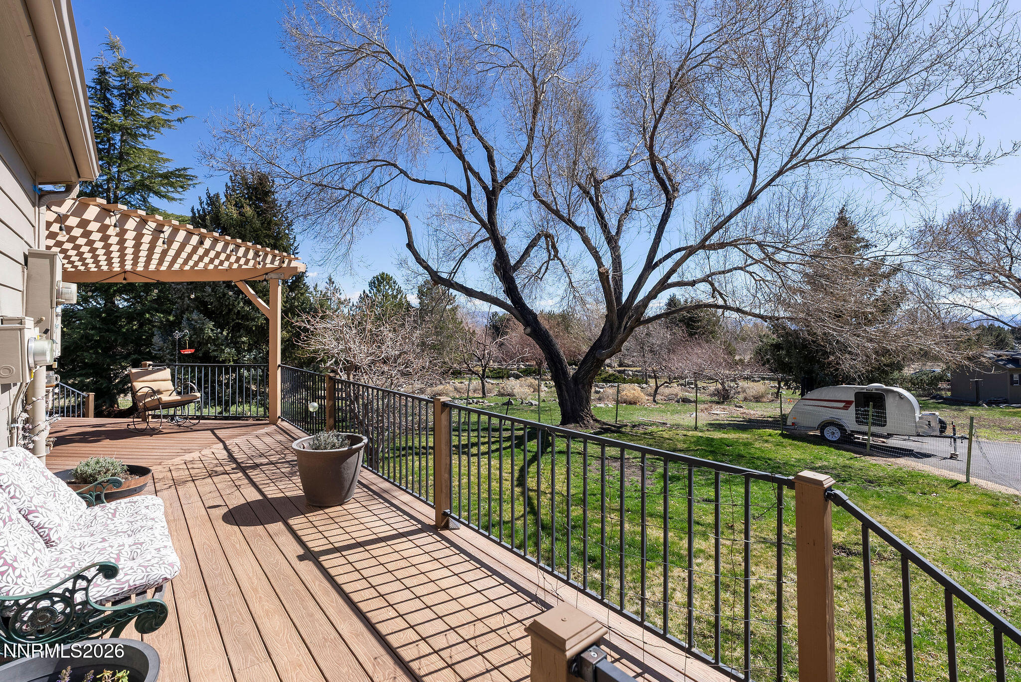 220 Limousin Court Genoa, NV 89411 - Photo 71 of 77 a view of a patio with table and chairs and wooden floor