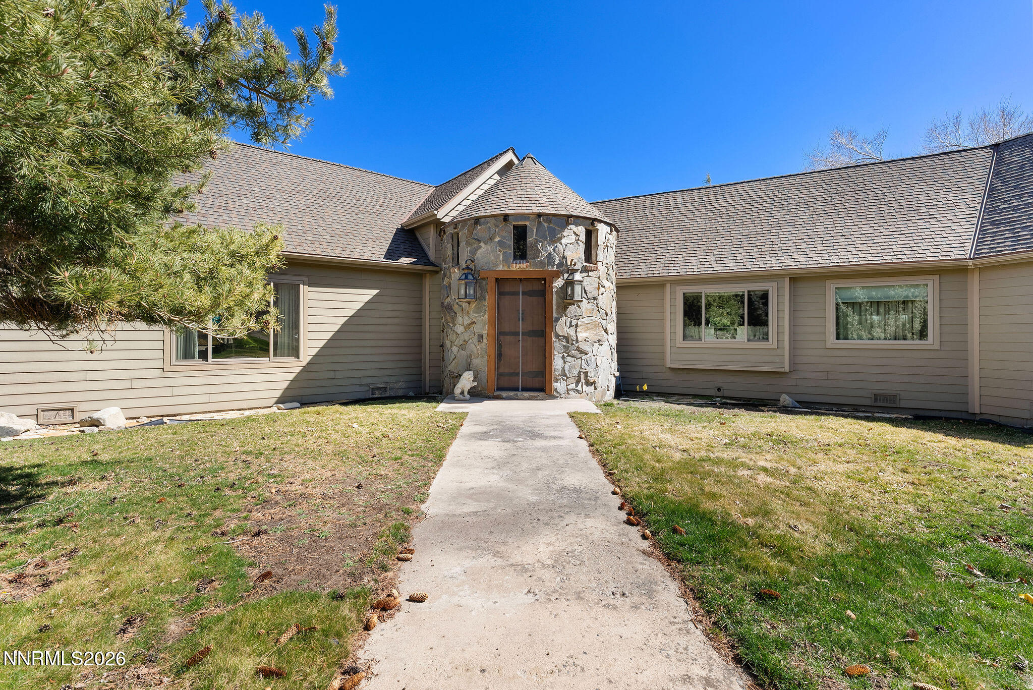 220 Limousin Court Genoa, NV 89411 - Photo 8 of 77 a front view of a house with a yard