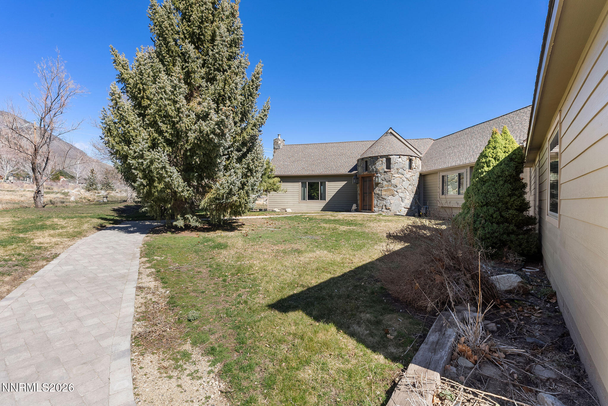 220 Limousin Court Genoa, NV 89411 - Photo 9 of 77 a view of a yard with a house