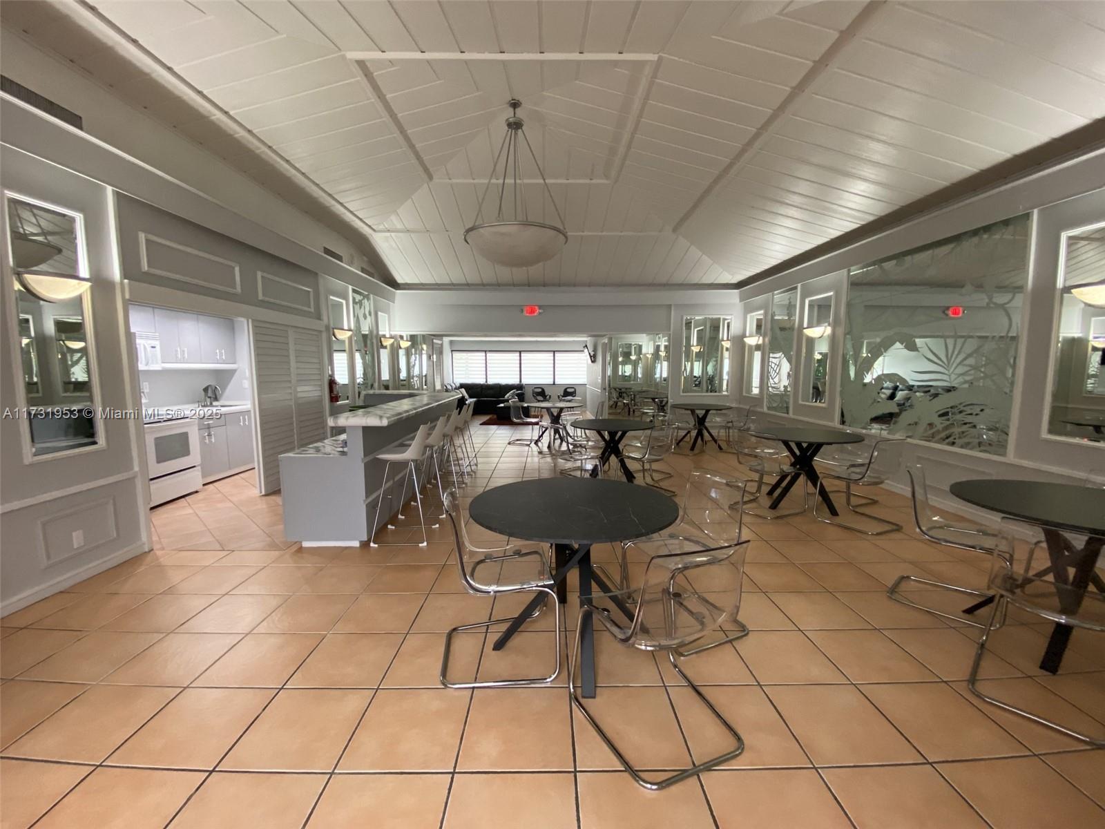 7787 Southwest 86th Street, Unit E211 Miami, FL 33143 - Photo 23 of 27 a view of a room with gym equipment