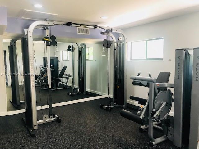 7787 Southwest 86th Street, Unit E211 Miami, FL 33143 - Photo 27 of 27 a room with gym equipment
