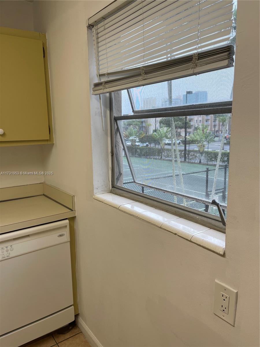 7787 Southwest 86th Street, Unit E211 Miami, FL 33143 - Photo 3 of 27 a view of a door and wooden floor