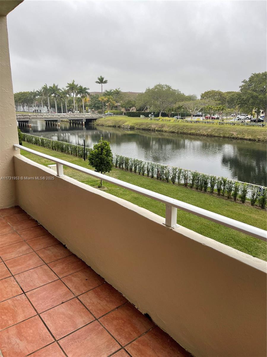 7787 Southwest 86th Street, Unit E211 Miami, FL 33143 - Photo 7 of 27 a view of a lake with a city