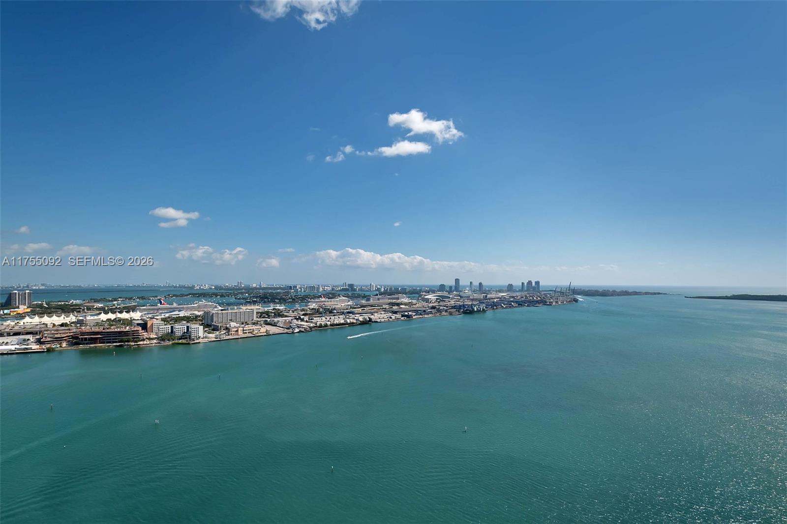 848 Brickell Key Drive, Unit 4002 Miami, FL 33131 - Photo 3 of 18 a view of a lake in middle of the building
