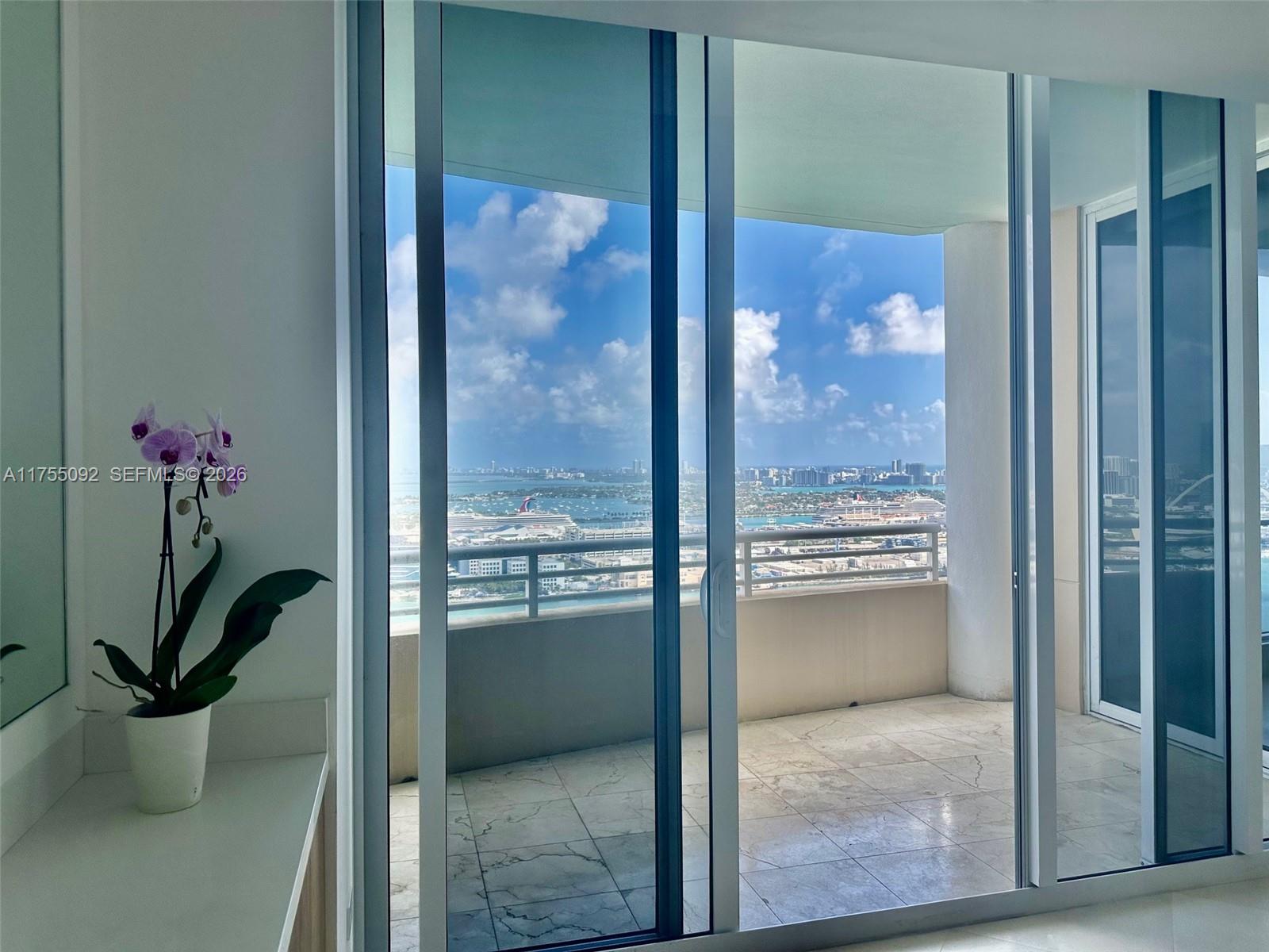 848 Brickell Key Drive, Unit 4002 Miami, FL 33131 - Photo 4 of 18 a view of a bathroom with a glass door