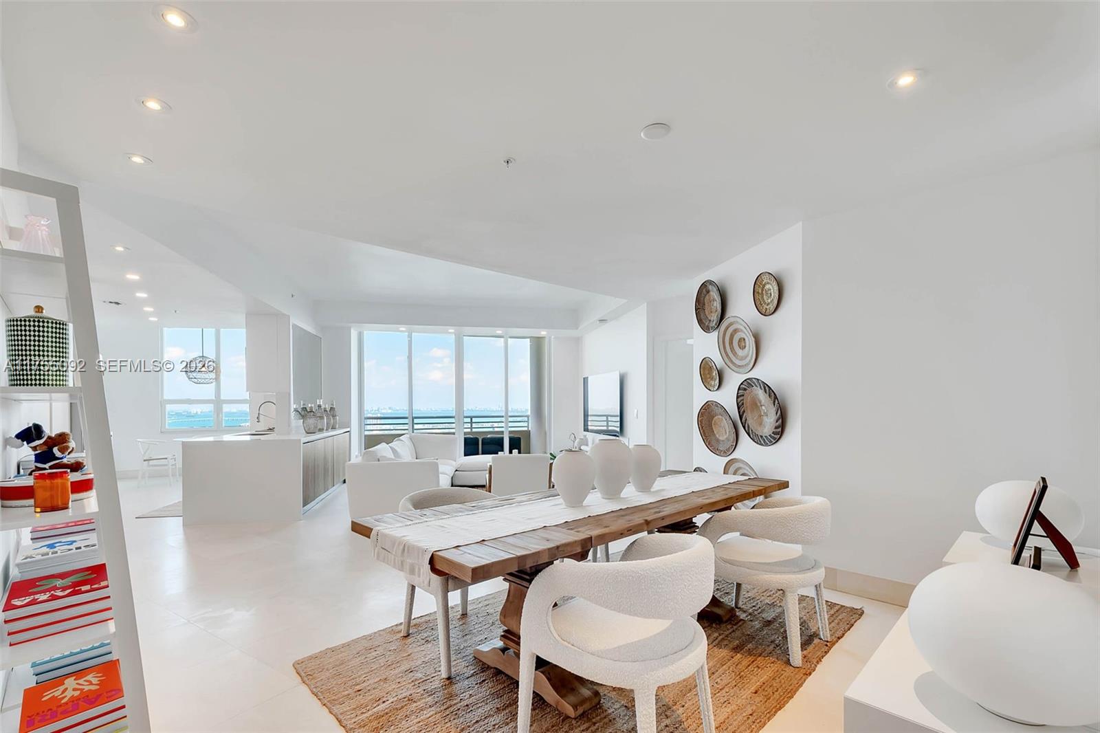 848 Brickell Key Drive, Unit 4002 Miami, FL 33131 - Photo 9 of 18 a living room with furniture and window