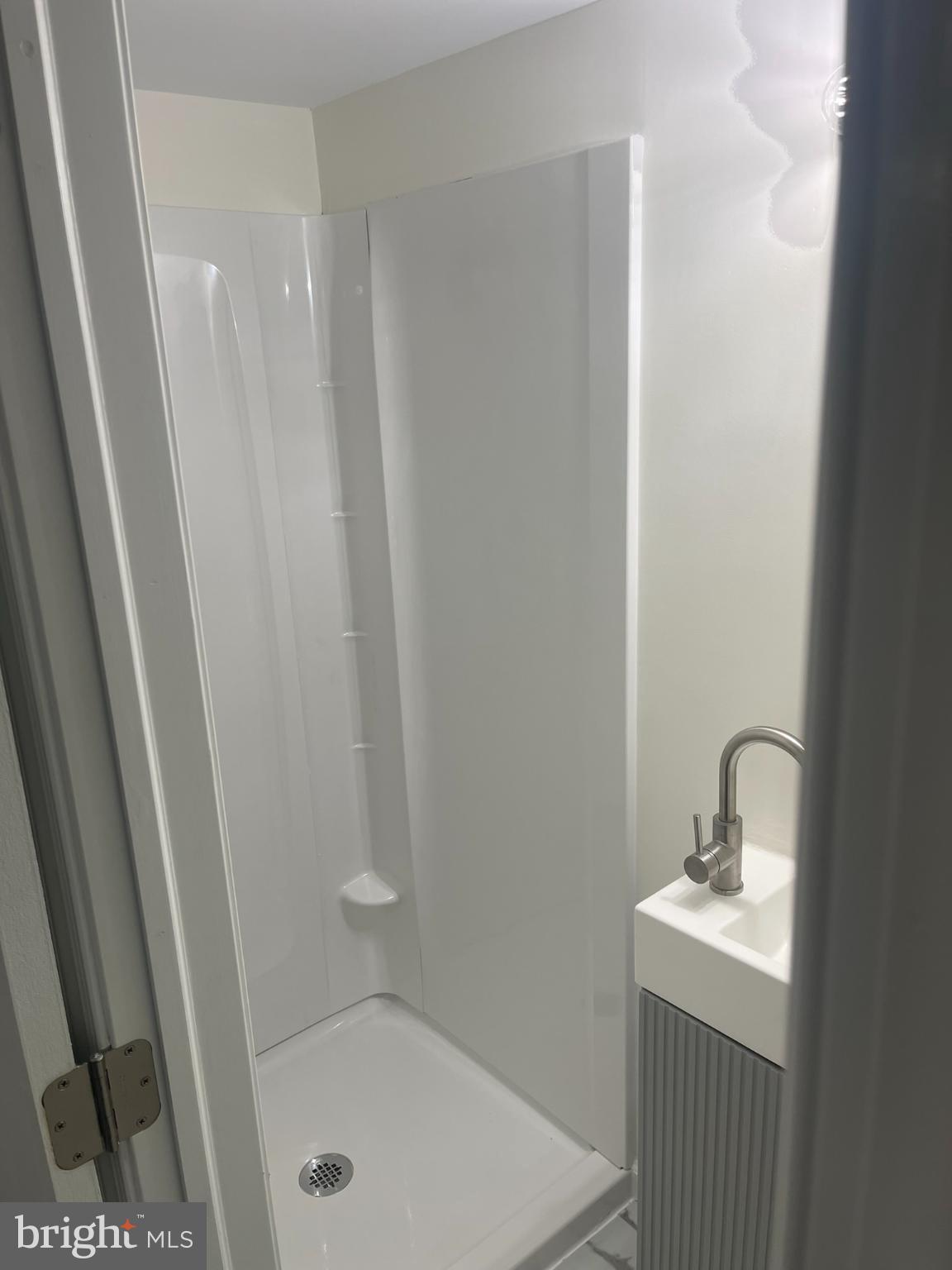 4111 Roland View Avenue Baltimore, MD 21215 - Photo 10 of 10 a bathroom with a sink and mirror