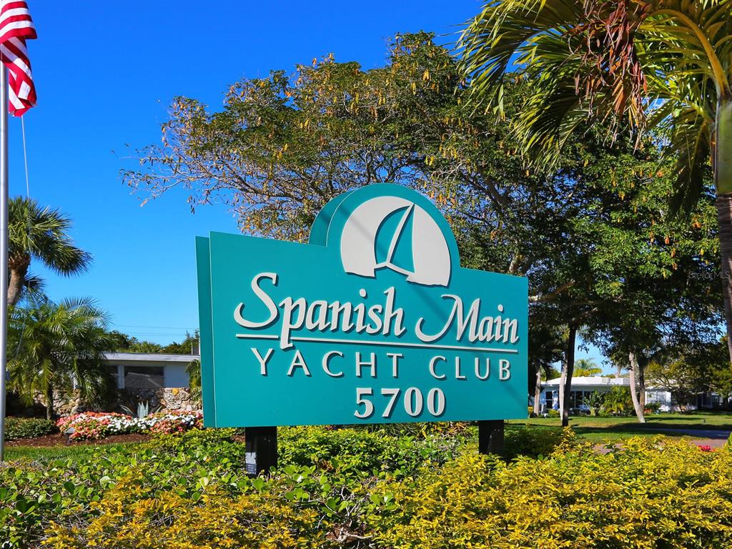 667 El Centro Longboat Key, FL 34228 - Photo 2 of 41 a sign broad in front of the red brick building