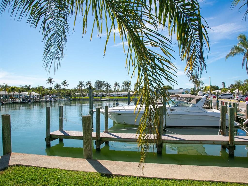 667 El Centro Longboat Key, FL 34228 - Photo 6 of 41 a view of swimming pool with a table and chairs