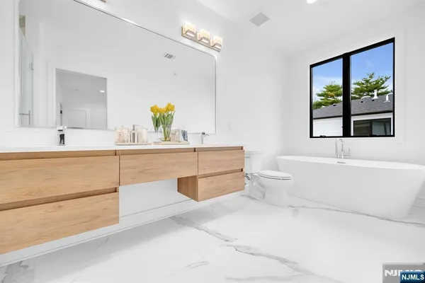a bathroom with a sink a toilet and a bathtub