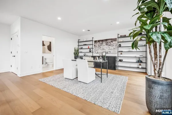 a view of a living room and kitchen