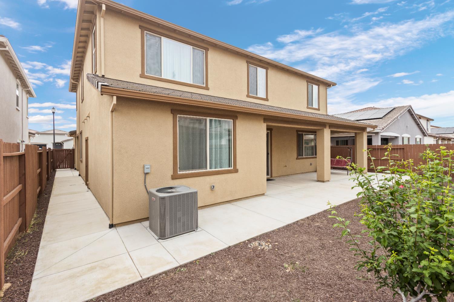 1072 Blue Range Way Roseville, CA 95747 - Photo 25 of 26 a view of a house with backyard and porch