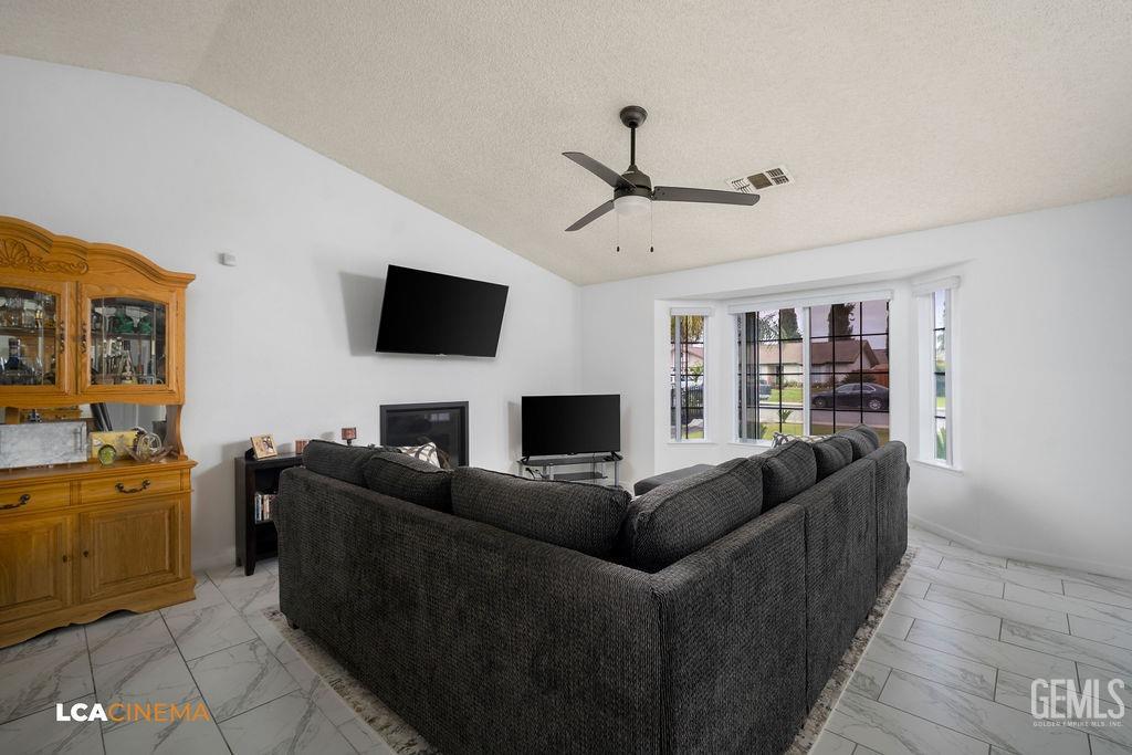 Undisclosed Address Delano, CA 93215 - Photo 13 of 35 a living room with furniture and a flat screen tv